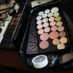 Assorted makeup palette and brushes set, perfect for professional or personal use.