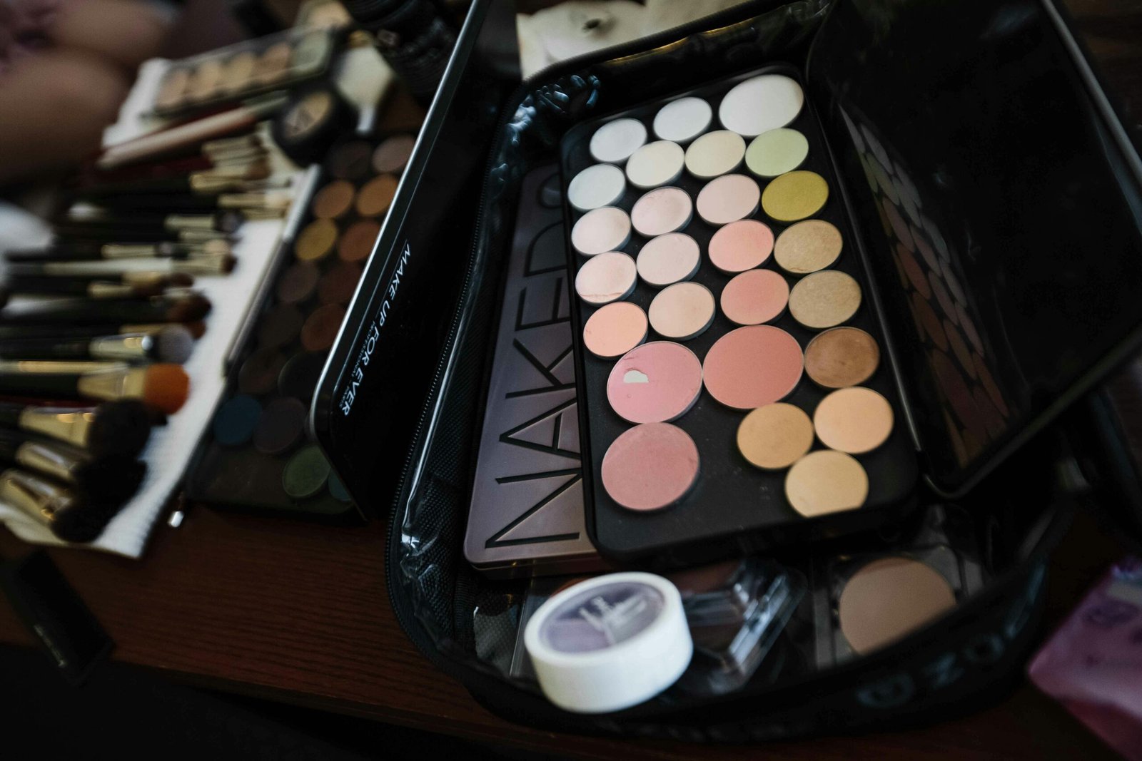 Assorted makeup palette and brushes set, perfect for professional or personal use.